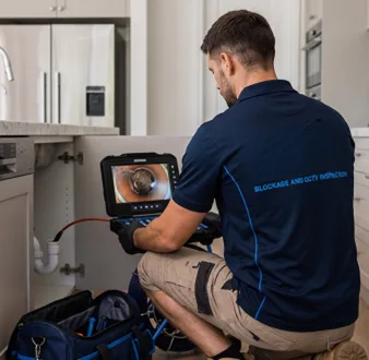 Clearing a blocked sink at a Gymea property